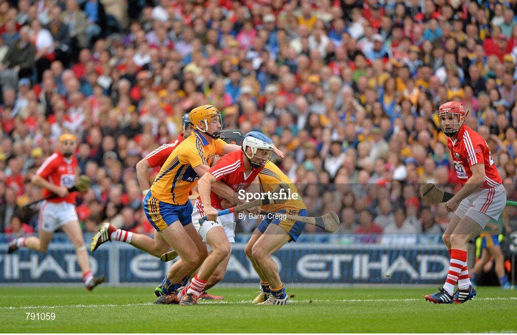 8 September 2013; Luke O'Farrell, Cork, in action against Cian Dillon, left, and Domhnall O'Donovan, Clare. GAA Hurling All-Ireland Senior Championship Final, Cork v Clare, Croke Park, Dublin. Picture credit: Barry Cregg / SPORTSFILE