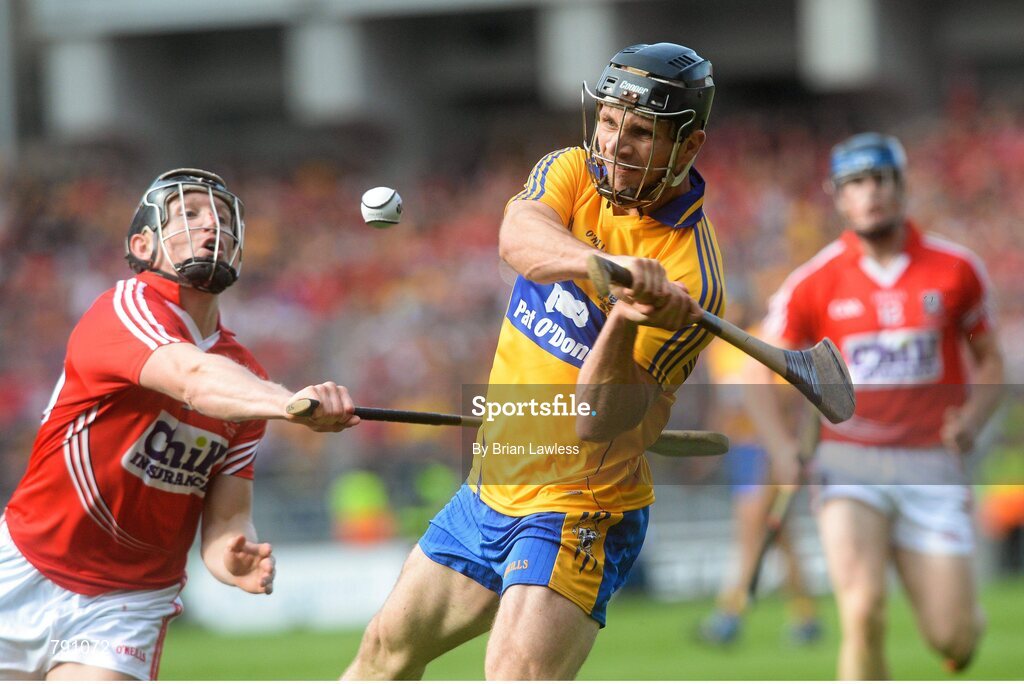 8 September 2013; Domhnall O'Donovan, Clare, shoots to score the equalising point despite the attentions of Stephen White, Cork. GAA Hurling All-Ireland Senior Championship Final, Cork v Clare, Croke Park, Dublin. Picture credit: Brian Lawless / SPORTSFILE