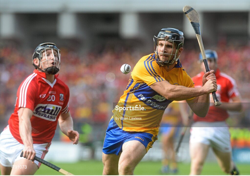 8 September 2013; Domhnall O'Donovan, Clare, shoots to score the equalising point despite the attentions of Stephen White, Cork. GAA Hurling All-Ireland Senior Championship Final, Cork v Clare, Croke Park, Dublin. Picture credit: Brian Lawless / SPORTSFILE