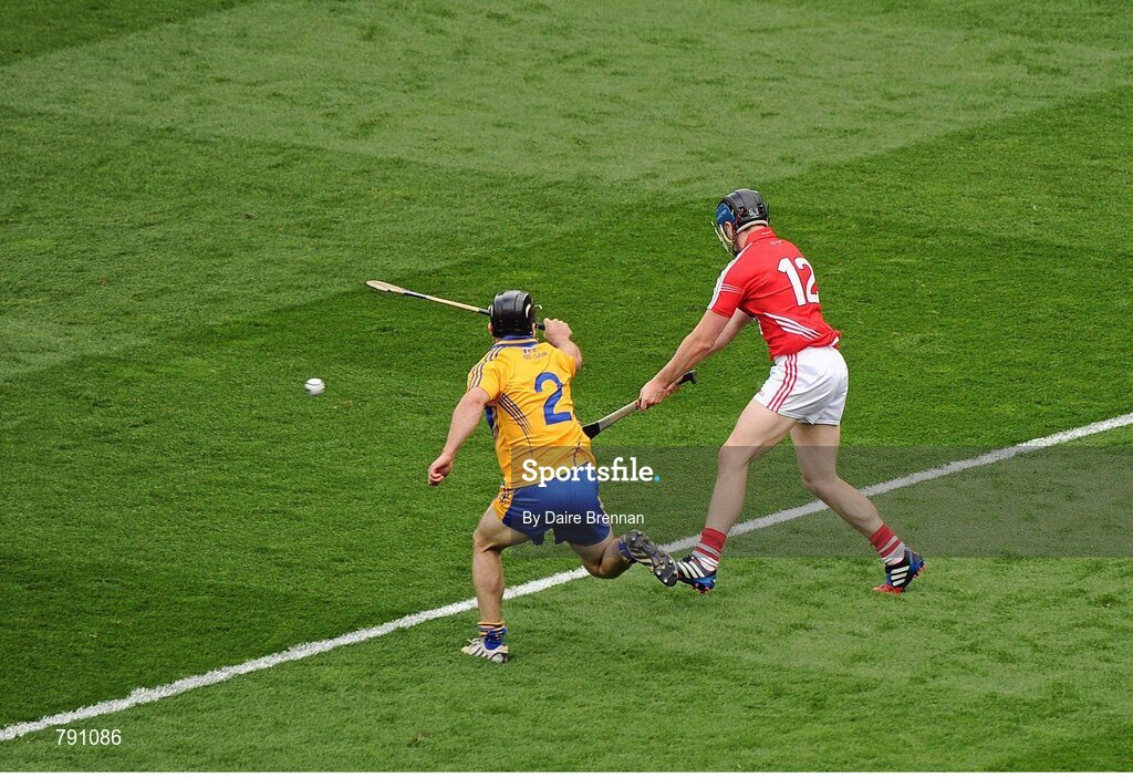 8 September 2013; Conor Lehane, Cork, scores his side's first goal despite the challenge from Domhnall O'Donovan, Clare. GAA Hurling All-Ireland Senior Championship Final, Cork v Clare, Croke Park, Dublin. Picture credit: Dáire Brennan / SPORTSFILE