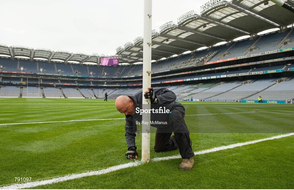 8 September 2013; Groundsman Marcel Bentea puts the finishing touches to the pitch with a scissors ahead of the day's matches. GAA Hurling All-Ireland Senior Championship Final, Cork v Clare, Croke Park, Dublin. Picture credit: Ray McManus / SPORTSFILE