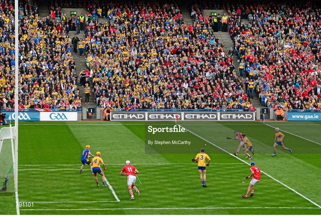 8 September 2013; Conor Lehane, Cork, scores his side's first goal despite the challenge from Domhnall O'Donovan, Clare. GAA Hurling All-Ireland Senior Championship Final, Cork v Clare, Croke Park, Dublin. Picture credit: Stephen McCarthy / SPORTSFILE