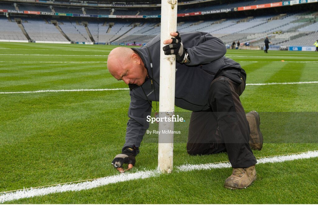 8 September 2013; Groundsman Marcel Bentea puts the finishing touches to the pitch with a scissors ahead of the day's matches. GAA Hurling All-Ireland Senior Championship Final, Cork v Clare, Croke Park, Dublin. Picture credit: Ray McManus / SPORTSFILE