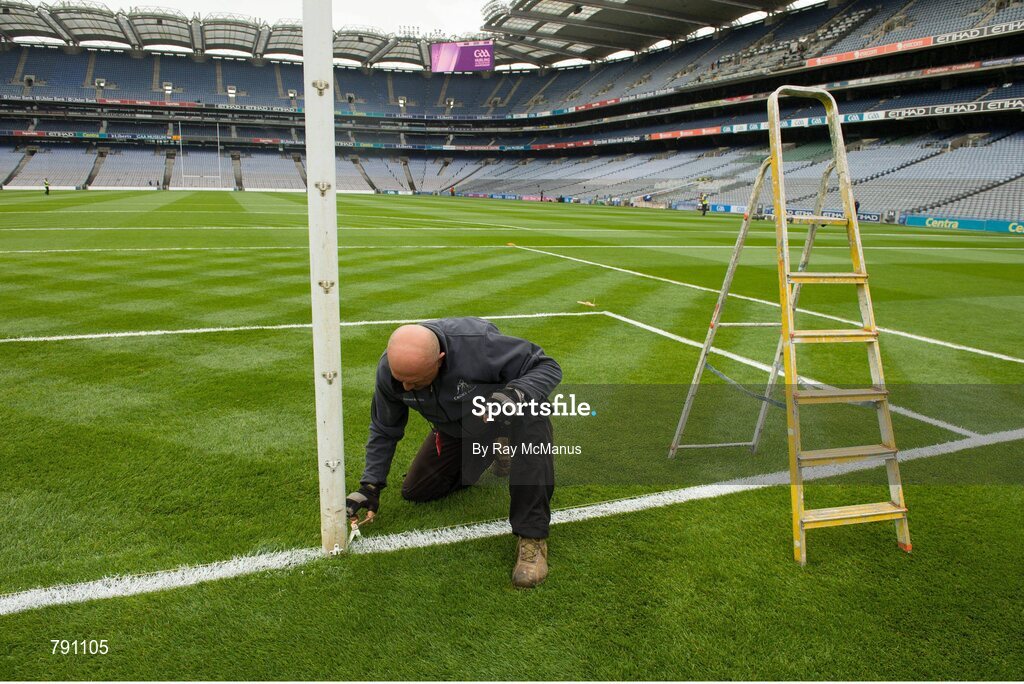 8 September 2013; Groundsman Marcel Bentea puts the finishing touches to the pitch with a scissors ahead of the day's matches. GAA Hurling All-Ireland Senior Championship Final, Cork v Clare, Croke Park, Dublin. Picture credit: Ray McManus / SPORTSFILE
