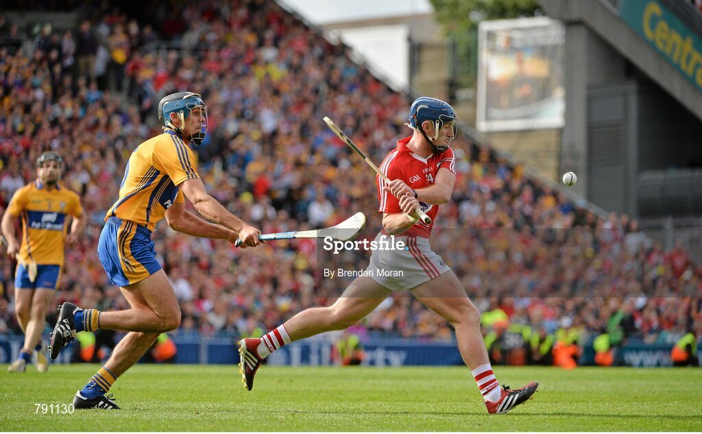 8 September 2013; Patrick Horgan, Cork, escapes the reach of Brendan Bugler, Clare, to score his side's last point of the game which put them into the lead before Clare equalised to send the game to a replay. GAA Hurling All-Ireland Senior Championship Final, Cork v Clare, Croke Park, Dublin. Picture credit: Brendan Moran / SPORTSFILE