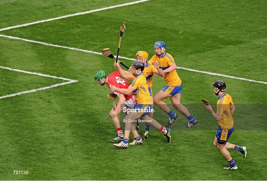 8 September 2013; SŽamus Harnedy, Cork, is fouled by Clare players, left to right, Domhnall O'Donovan, Cian Dillon, Conor Ryan and Patrick Donnellan, which resulted in a Cork penalty. GAA Hurling All-Ireland Senior Championship Final, Cork v Clare, Croke Park, Dublin. Picture credit: Dáire Brennan / SPORTSFILE