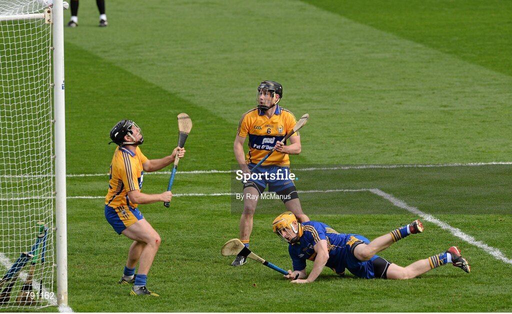 8 September 2013; The sliothar strikes the crossbar as Clare players Patrick Kelly, captain Patrick Donnellan and Colin Ryan combine to save a Cork penalty late in the game . GAA Hurling All-Ireland Senior Championship Final, Cork v Clare, Croke Park, Dublin. Picture credit: Ray McManus / SPORTSFILE
