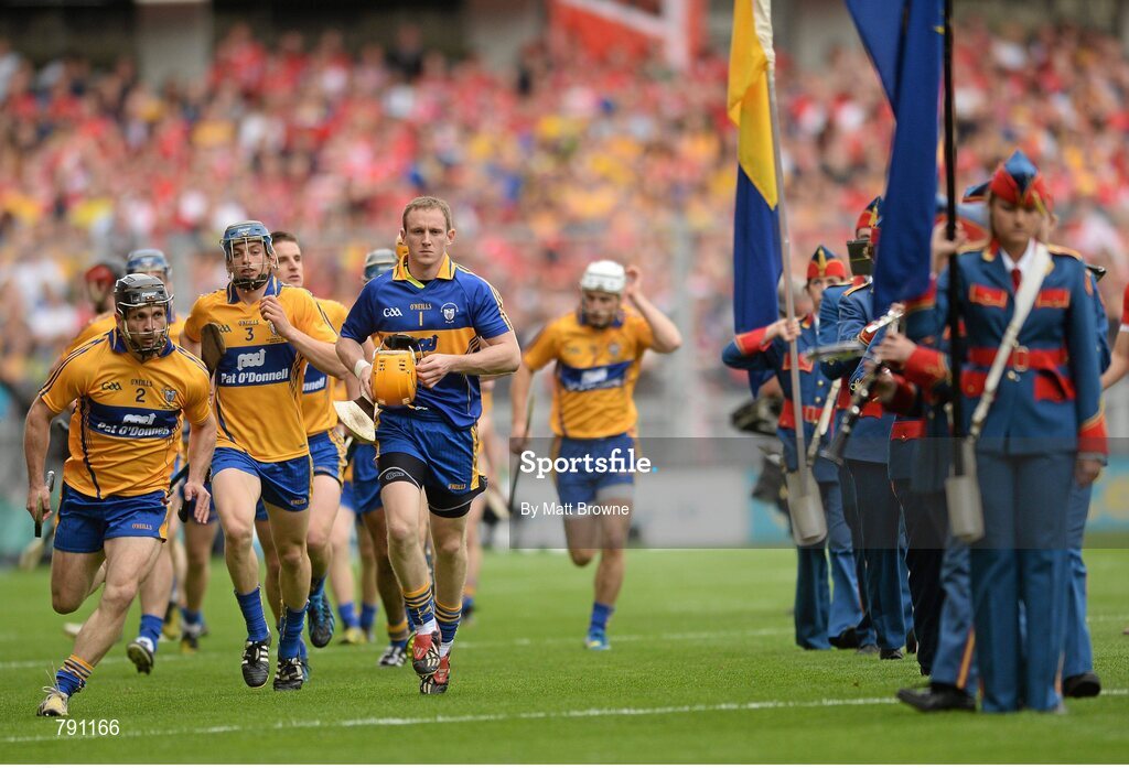 8 September 2013; Clare players make their way past the Artane School of Music Band after the prade. GAA Hurling All-Ireland Senior Championship Final, Cork v Clare, Croke Park, Dublin. Picture credit: Matt Browne / SPORTSFILE