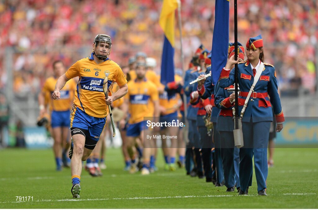 8 September 2013; Clare captain Patrick Donnellan makes his way past the Artane School of Music Band after the prade. GAA Hurling All-Ireland Senior Championship Final, Cork v Clare, Croke Park, Dublin. Picture credit: Matt Browne / SPORTSFILE