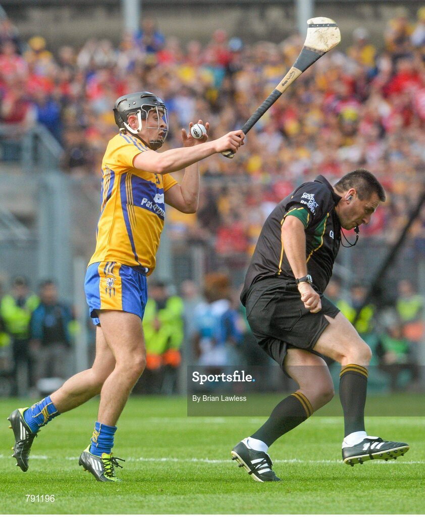 8 September 2013; Clare's Nicky O'Connell narrowly avoids a collision with referee Brian Gavin in the last minute of the match. GAA Hurling All-Ireland Senior Championship Final, Cork v Clare, Croke Park, Dublin. Picture credit: Brian Lawless / SPORTSFILE