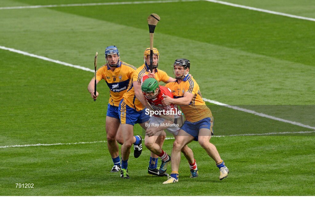 8 September 2013; SÃ©amus Harnedy, Cork, is tackled by Clare players Domhnall O'Donovan, Cian Dillon, who was shown a yellow card, and Conor Ryan. The referee awarded a penalty as a result of this tackle. GAA Hurling All-Ireland Senior Championship Final, Cork v Clare, Croke Park, Dublin. Picture credit: Ray McManus / SPORTSFILE