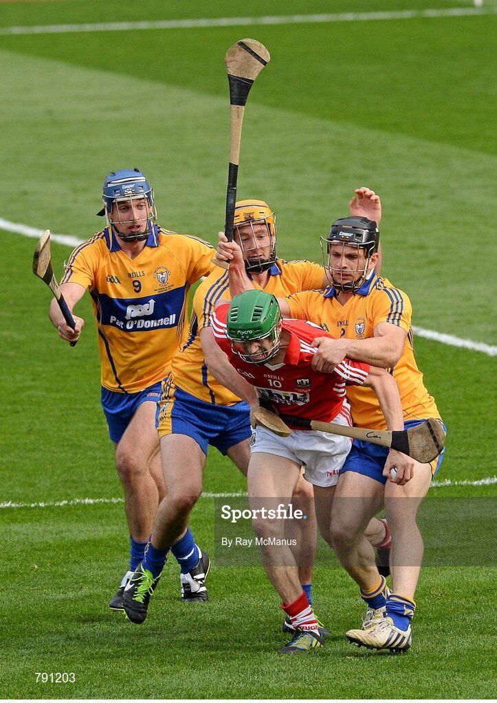 8 September 2013; SÃ©amus Harnedy, Cork, is tackled by Clare players Domhnall O'Donovan, Cian Dillon, who was shown a yellow card, and Conor Ryan. The referee awarded a penalty as a result of this tackle. GAA Hurling All-Ireland Senior Championship Final, Cork v Clare, Croke Park, Dublin. Picture credit: Ray McManus / SPORTSFILE