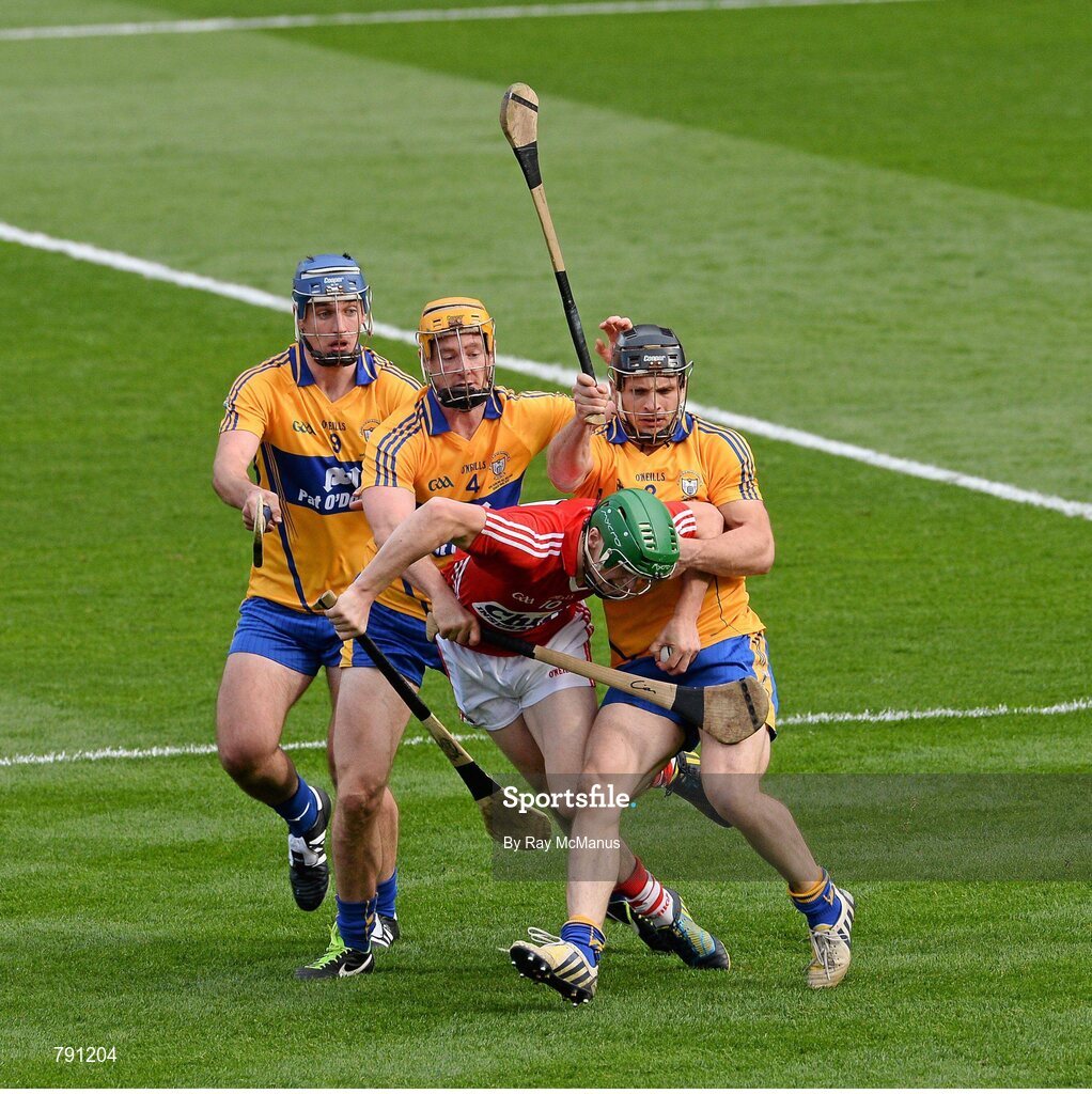 8 September 2013; SÃ©amus Harnedy, Cork, is tackled by Clare players Domhnall O'Donovan, Cian Dillon, who was shown a yellow card, and Conor Ryan. The referee awarded a penalty as a result of this tackle. GAA Hurling All-Ireland Senior Championship Final, Cork v Clare, Croke Park, Dublin. Picture credit: Ray McManus / SPORTSFILE