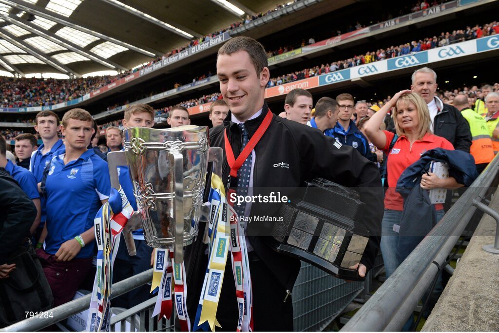 8 September 2013; Ard Comhairle stewart Colm Smith removes the Liam MacCarthy Cup to safe keeping after the game ended in a draw. GAA Hurling All-Ireland Senior Championship Final, Cork v Clare, Croke Park, Dublin. Picture credit: Ray McManus / SPORTSFILE