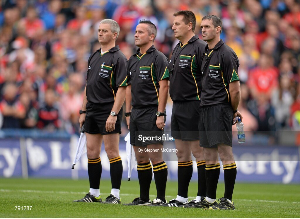8 September 2013; Referee Brian Gavin, second from right, stands with his officials, from left, Johnny Ryan, James McGrath and James Owen stand for a minute silence ahead of the game. GAA Hurling All-Ireland Senior Championship Final, Cork v Clare, Croke Park, Dublin. Picture credit: Stephen McCarthy / SPORTSFILE