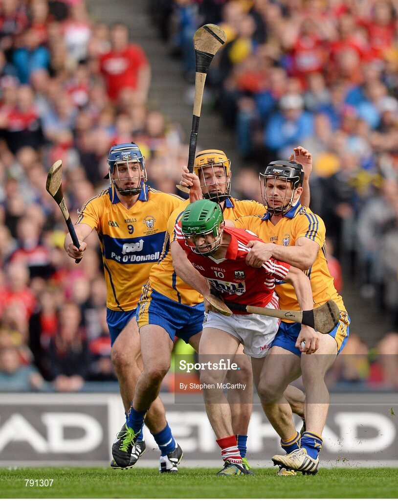 8 September 2013; Séamus Harnedy, Cork, is tackled by Clare players, from left, Conor Ryan, Cian Dillon and Brendan Bugler, resulting in a penalty. GAA Hurling All-Ireland Senior Championship Final, Cork v Clare, Croke Park, Dublin. Picture credit: Stephen McCarthy / SPORTSFILE