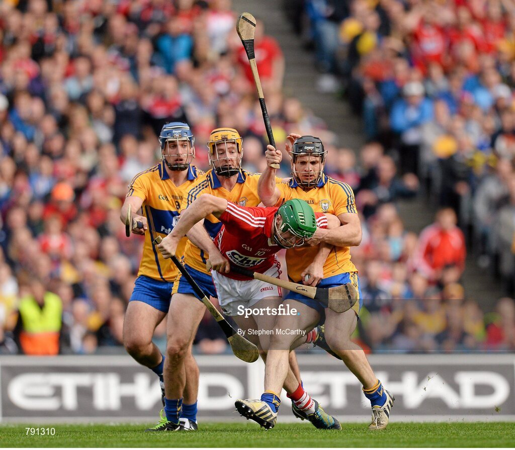 8 September 2013; Séamus Harnedy, Cork, is tackled by Clare players, from left, Conor Ryan, Cian Dillon and Brendan Bugler, resulting in a penalty. GAA Hurling All-Ireland Senior Championship Final, Cork v Clare, Croke Park, Dublin. Picture credit: Stephen McCarthy / SPORTSFILE