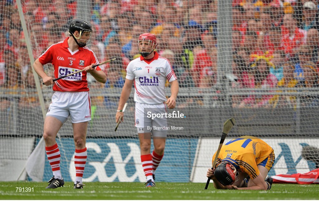 8 September 2013; Darach Honan, Clare, lies injured on the field, watched by Shane O'Neill, Cork. Both players were subsequently shown a yellow card by referee Brian Gavin. GAA Hurling All-Ireland Senior Championship Final, Cork v Clare, Croke Park, Dublin. Picture credit: Brendan Moran / SPORTSFILE