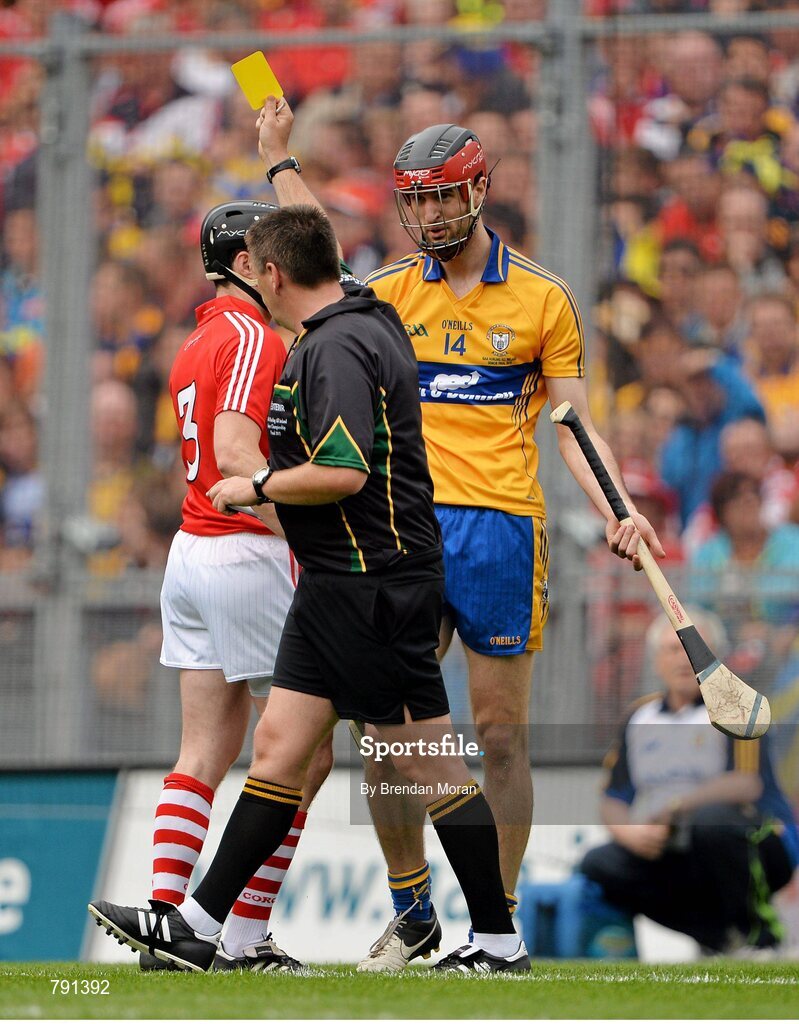 8 September 2013; Darach Honan, Clare, and Shane O'Neill, Cork, are both shown a yellow card by referee Brian Gavin. GAA Hurling All-Ireland Senior Championship Final, Cork v Clare, Croke Park, Dublin. Picture credit: Brendan Moran / SPORTSFILE