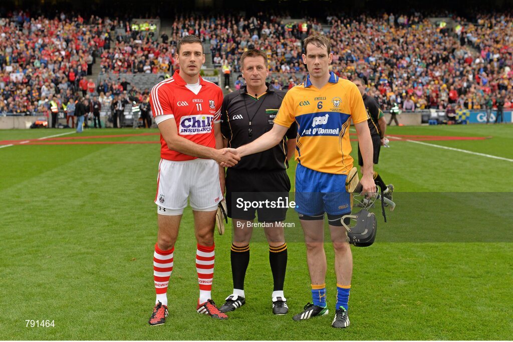 8 September 2013; Team captains Patrick Cronin, Cork, and Patrick Donnellan, Clare, shake hands in the company of referee Brian Gavin before the game. GAA Hurling All-Ireland Senior Championship Final, Cork v Clare, Croke Park, Dublin. Picture credit: Brendan Moran / SPORTSFILE