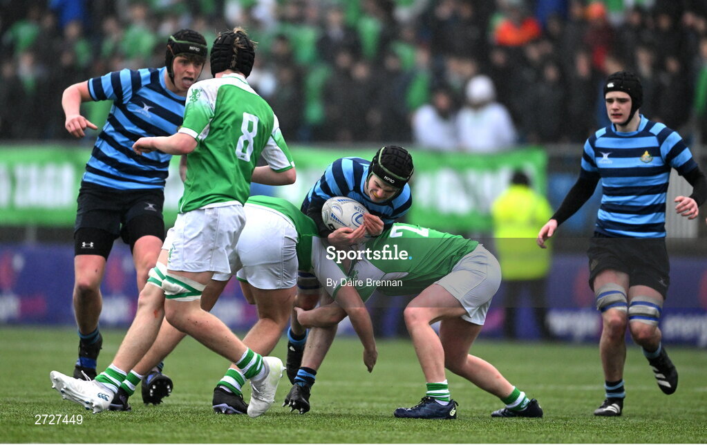 8 February 2024; Matthew McGee of St Vincent’s Castleknock College is tackled by George Loomes, left, and Cian Start of Gonzaga College during Bank of Ireland Leinster Schools Junior Cup Round 1 match between St Vincent's Castleknock College and Gonzaga College at Energia Park in Dublin. Photo by Daire Brennan/Sportsfile
