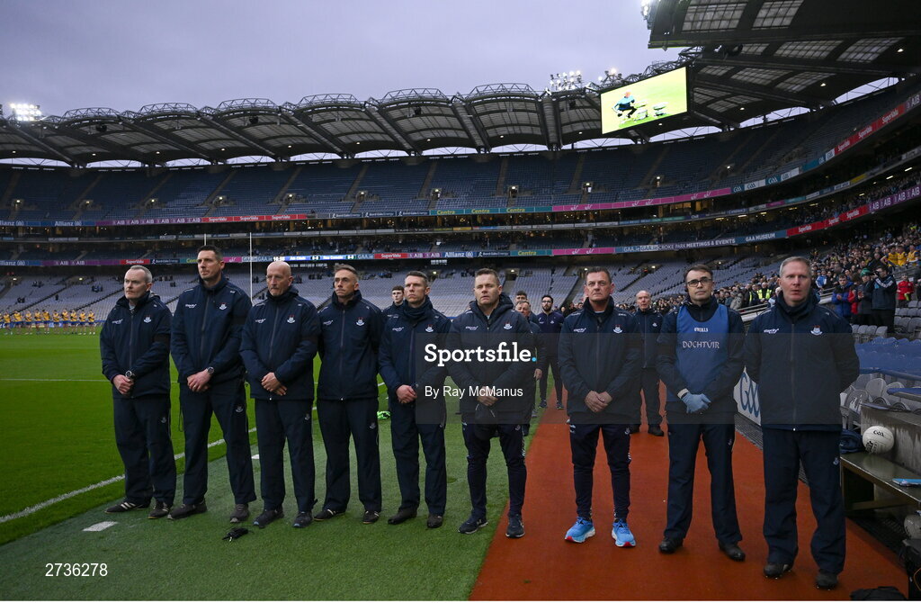 17 February 2024; Sean Murphy, backroom,  Brian O’Regan, selector, Mick Galvin, selector, Ger Lyons, selector, Darren Daly, selector, Dessie Farrell, Dublin manager, Séamus McCormack, Media Manager, Dr Diarmuid Smyth, James Allen, Chartered Physiotherapist during a minutes silence in memory of the late Dublin selector Shane O'Hanlon before the Allianz Football League Division 1 match between Dublin and Roscommon at Croke Park in Dublin. Photo by Ray McManus/Sportsfile