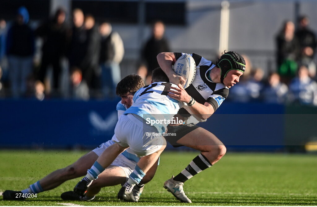 22 February 2024; Evan Brophy of Cistercian College Roscrea is tackled by Conor O'Shaughnessy and Luke Coffey of Blackrock College during the Bank of Ireland Leinster Schools Senior Cup quarter-final match between Cistercian College, Roscrea and Blackrock College at Energia Park in Dublin. Photo by Sam Barnes/Sportsfile