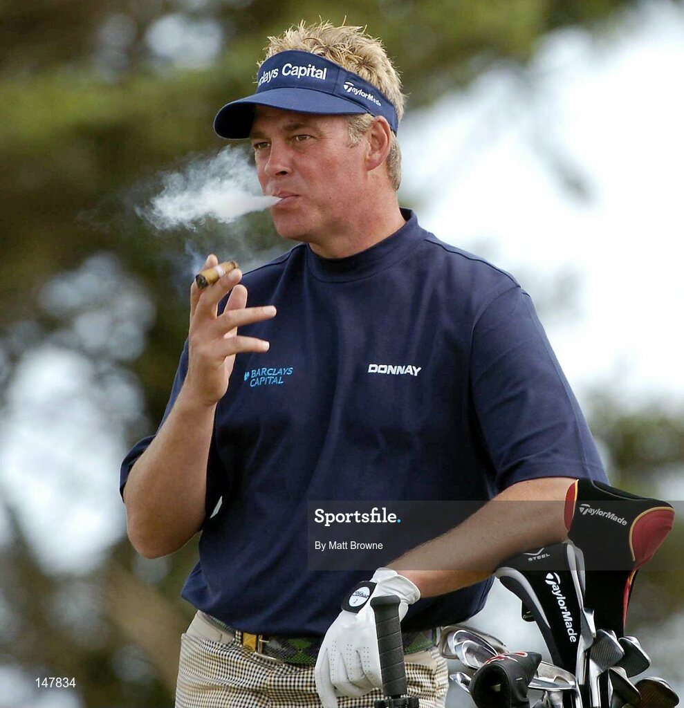21 July 2004; Darren Clarke smokes a cigar at the 17th tee box during the first round. Nissan Irish Open Golf Championship, County Louth Golf Club, Baltray, Co. Louth. Picture credit; Matt Browne / SPORTSFILE
