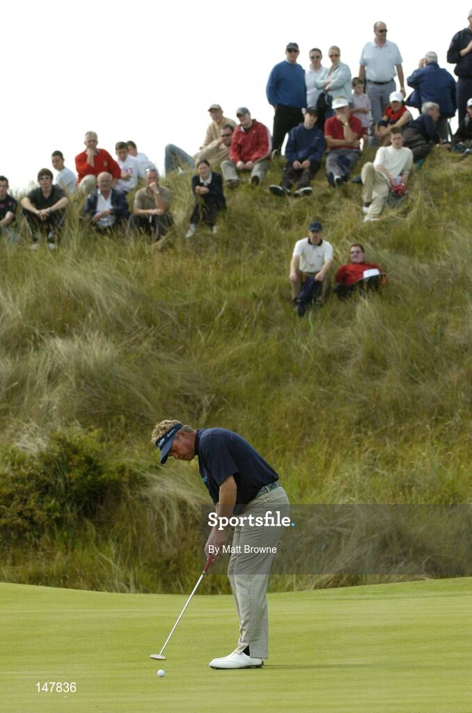 21 July 2004; Darren Clarke watches his putt on the 14th green during the first round. Nissan Irish Open Golf Championship, County Louth Golf Club, Baltray, Co. Louth. Picture credit; Matt Browne / SPORTSFILE