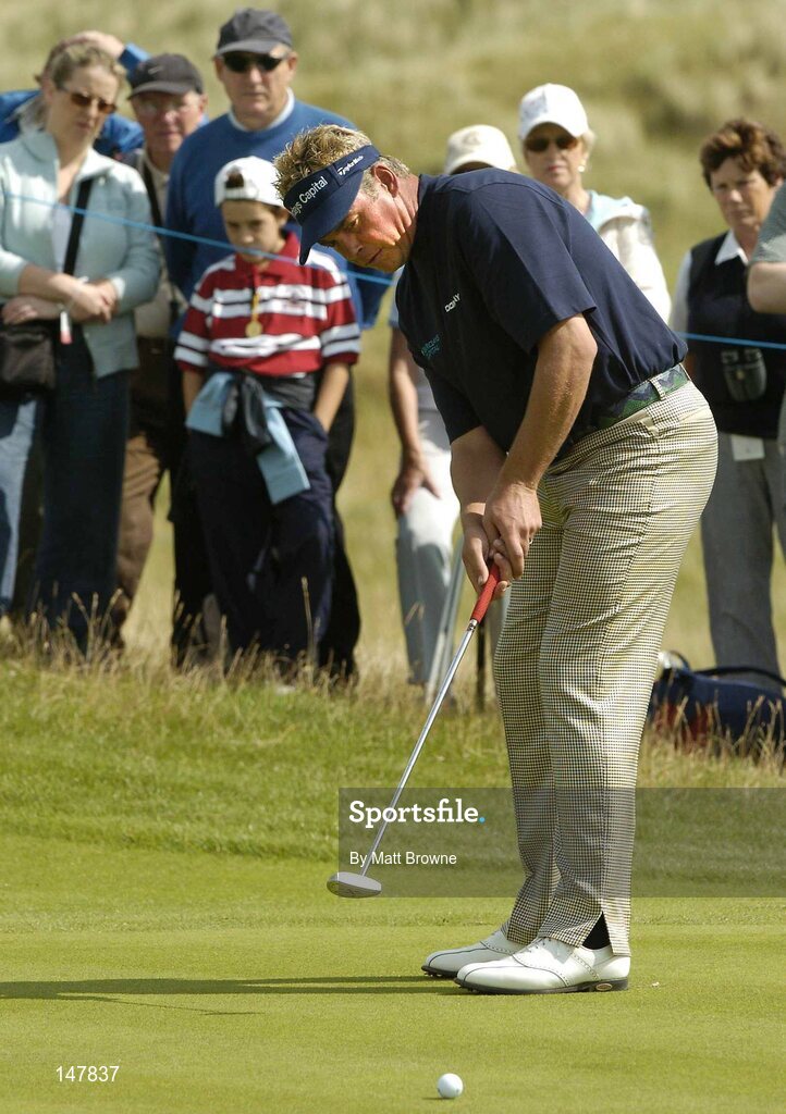 21 July 2004; Darren Clarke watches his putt on the 16th green during the first round. Nissan Irish Open Golf Championship, County Louth Golf Club, Baltray, Co. Louth. Picture credit; Matt Browne / SPORTSFILE