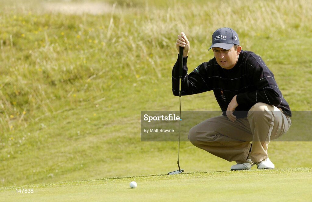 21 July 2004; Peter Lawrie lines up a putt on the 14th green  during the first round. Nissan Irish Open Golf Championship, County Louth Golf Club, Baltray, Co. Louth. Picture credit; Matt Browne / SPORTSFILE