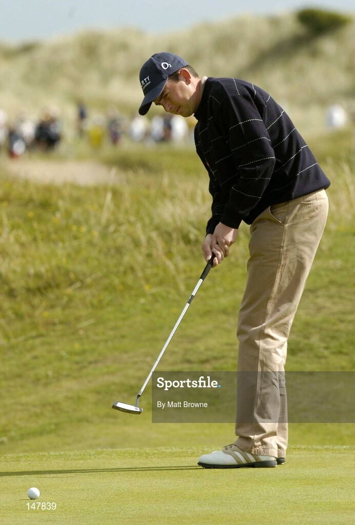 21 July 2004; Peter Lawrie watches his putt on the 14th green  during the first round. Nissan Irish Open Golf Championship, County Louth Golf Club, Baltray, Co. Louth. Picture credit; Matt Browne / SPORTSFILE