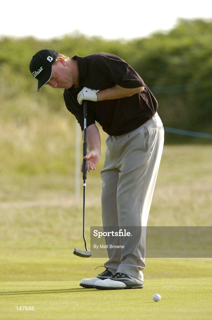 21 July 2004; Philip Walton watches his putt on the 1sf green during the first round. Nissan Irish Open Golf Championship, County Louth Golf Club, Baltray, Co. Louth. Picture credit; Matt Browne / SPORTSFILE