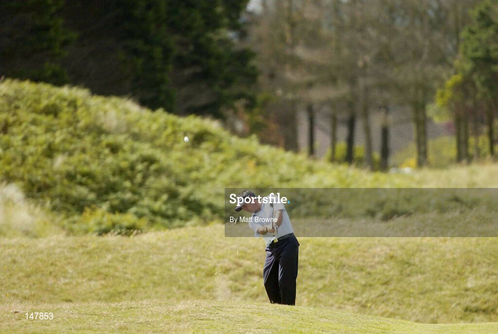 21 July 2004; Paul McGinley plays his second shot from the rough on the 4th fairway during the first round. Nissan Irish Open Golf Championship, County Louth Golf Club, Baltray, Co. Louth. Picture credit; Matt Browne / SPORTSFILE