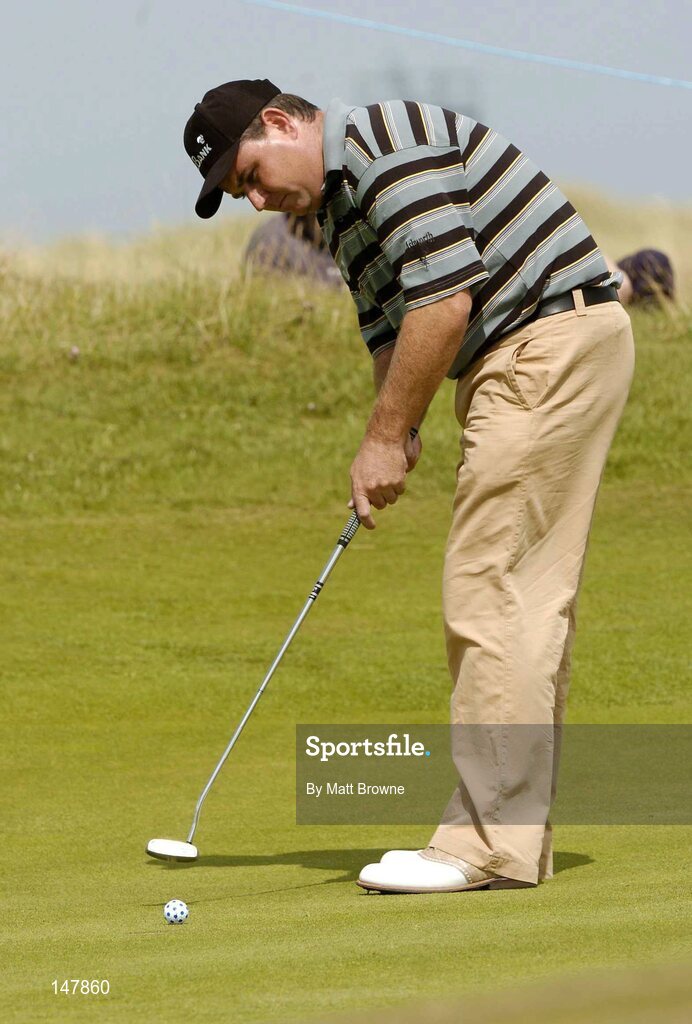 21 July 2004; Gary Murphy watches his putt on the 2nd green  during the first round. Nissan Irish Open Golf Championship, County Louth Golf Club, Baltray, Co. Louth. Picture credit; Matt Browne / SPORTSFILE