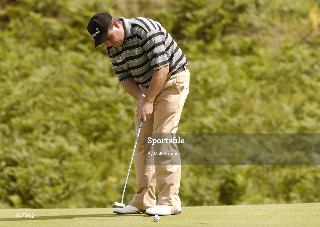 21 July 2004; Gary Murphy watches his putt on the 3rd green  during the first round. Nissan Irish Open Golf Championship, County Louth Golf Club, Baltray, Co. Louth. Picture credit; Matt Browne / SPORTSFILE