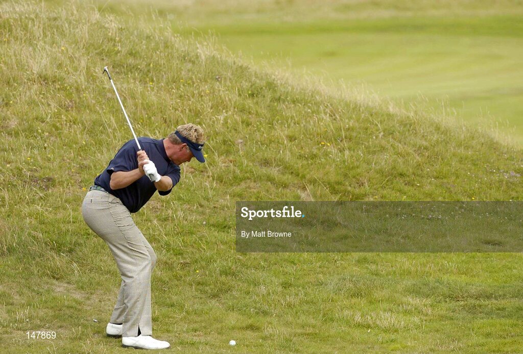 21 July 2004; Darren Clarke plays his second shot from the rough on the 6th fairway during the first round. Nissan Irish Open Golf Championship, County Louth Golf Club, Baltray, Co. Louth. Picture credit; Matt Browne / SPORTSFILE