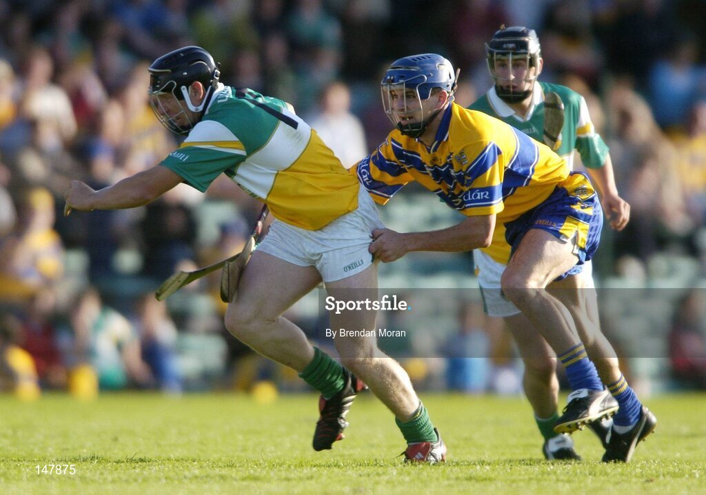 17 July 2004; Neville Coughlan, Offaly, in action against Gerry O'Grady, Clare. Guinness Senior Hurling Championship Qualifier, Round 3, Clare v Offaly, Gaelic Grounds, Limerick. Picture credit; Brendan Moran / SPORTSFILE