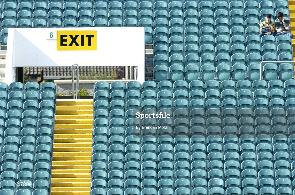 17 July 2004; Two fans sutdy the match programme before the start of the game. Guinness Senior Hurling Championship Qualifier, Round 3, Clare v Offaly, Gaelic Grounds, Limerick. Picture credit; Brendan Moran / SPORTSFILE