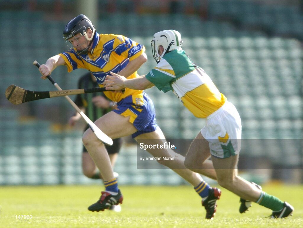 17 July 2004; Frank Lohan, Clare, in action against Gary Hanniffy, Offaly. Guinness Senior Hurling Championship Qualifier, Round 3, Clare v Offaly, Gaelic Grounds, Limerick. Picture credit; Brendan Moran / SPORTSFILE