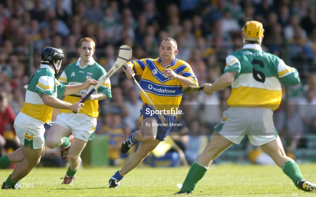17 July 2004; Colin Lynch, Clare, in action against Colm Cassidy, left, Barry Whelahan and Niall Claffey (6), Offaly. Guinness Senior Hurling Championship Qualifier, Round 3, Clare v Offaly, Gaelic Grounds, Limerick. Picture credit; Brendan Moran / SPORTSFILE