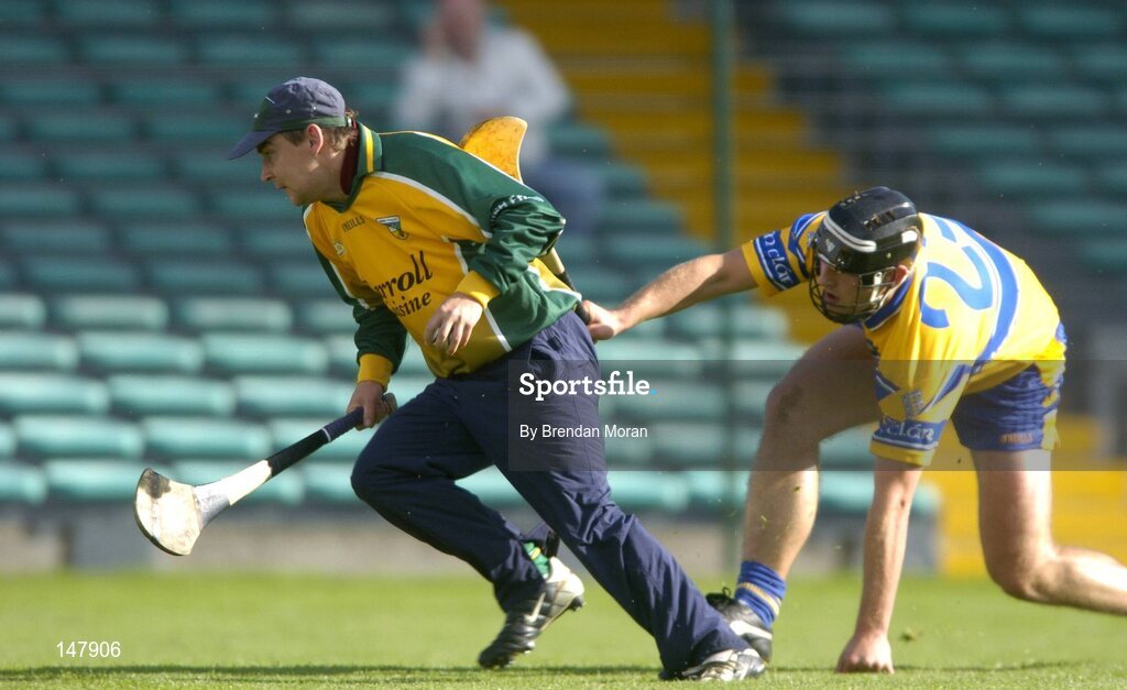 17 July 2004; Brian Mullins, Offaly, in action against Tony Carmody, Clare. Guinness Senior Hurling Championship Qualifier, Round 3, Clare v Offaly, Gaelic Grounds, Limerick. Picture credit; Brendan Moran / SPORTSFILE