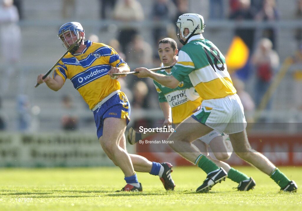 17 July 2004; Andrew Quinn, Clare, in action against Kevin Brady, Offaly. Guinness Senior Hurling Championship Qualifier, Round 3, Clare v Offaly, Gaelic Grounds, Limerick. Picture credit; Brendan Moran / SPORTSFILE