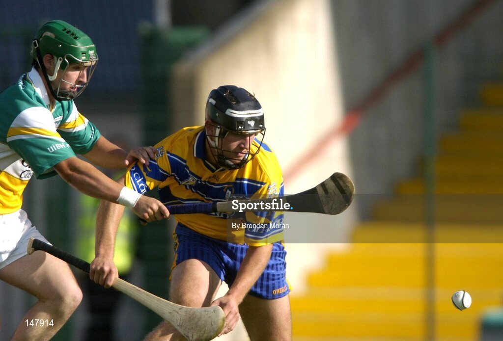17 July 2004; Tont Carmody, Clare, in action against Barry Teehan, Offaly. Guinness Senior Hurling Championship Qualifier, Round 3, Clare v Offaly, Gaelic Grounds, Limerick. Picture credit; Brendan Moran / SPORTSFILE