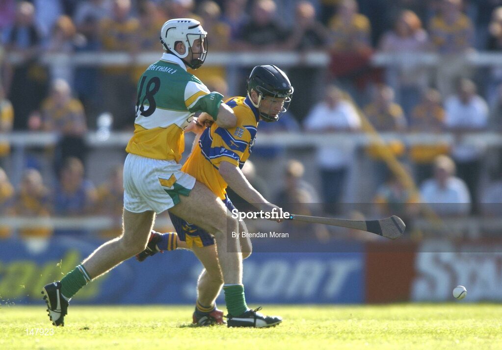 17 July 2004; Frank Lohan, Clare, in action against Kevin Brady, Offaly. Guinness Senior Hurling Championship Qualifier, Round 3, Clare v Offaly, Gaelic Grounds, Limerick. Picture credit; Brendan Moran / SPORTSFILE