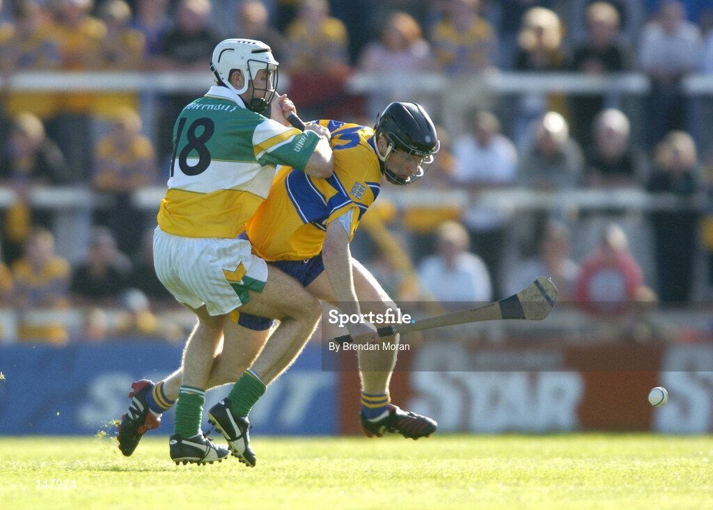 17 July 2004; Frank Lohan, Clare, in action against Kevin Brady, Offaly. Guinness Senior Hurling Championship Qualifier, Round 3, Clare v Offaly, Gaelic Grounds, Limerick. Picture credit; Brendan Moran / SPORTSFILE