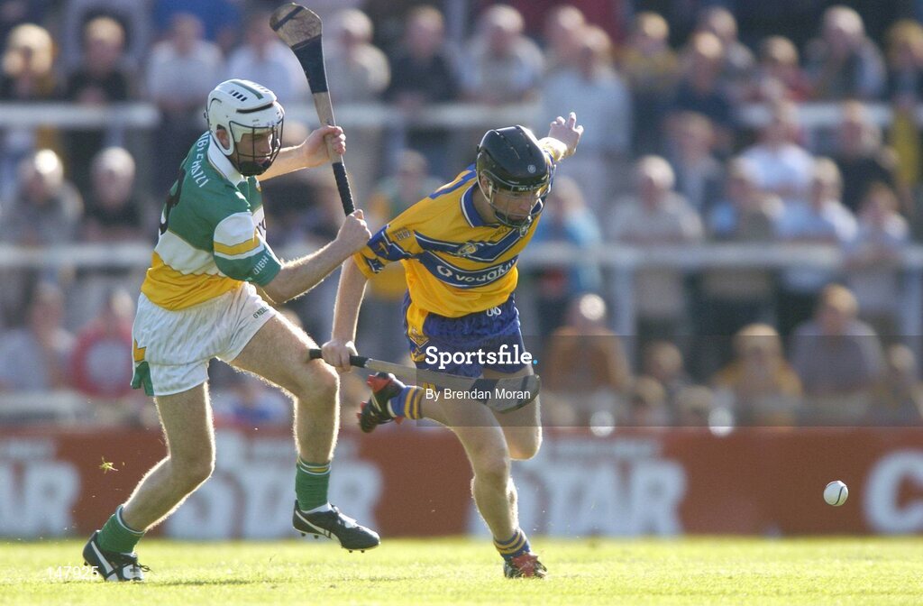 17 July 2004; Frank Lohan, Clare, in action against Kevin Brady, Offaly. Guinness Senior Hurling Championship Qualifier, Round 3, Clare v Offaly, Gaelic Grounds, Limerick. Picture credit; Brendan Moran / SPORTSFILE