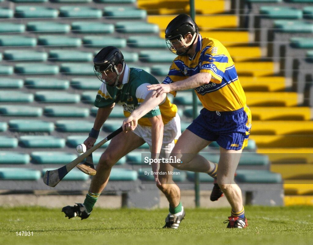 17 July 2004; Rory Hanniffy, Offaly, in action against Frank Lohan, Clare. Guinness Senior Hurling Championship Qualifier, Round 3, Clare v Offaly, Gaelic Grounds, Limerick. Picture credit; Brendan Moran / SPORTSFILE