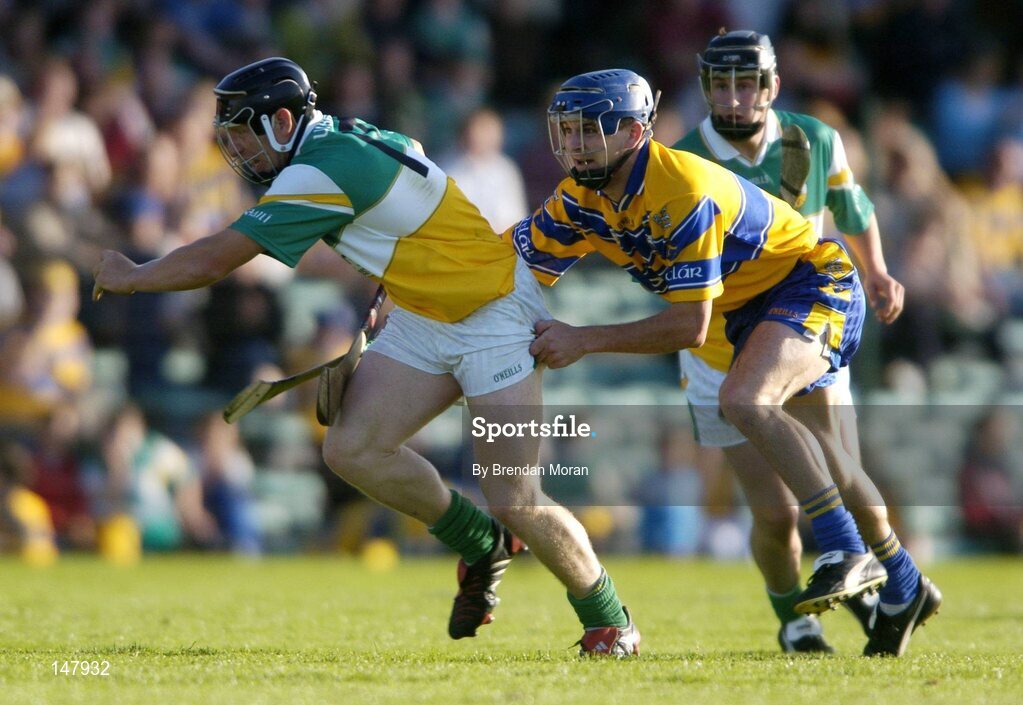 17 July 2004; Neville Coughlan, Offaly, in action against Gerry O'Grady, Clare. Guinness Senior Hurling Championship Qualifier, Round 3, Clare v Offaly, Gaelic Grounds, Limerick. Picture credit; Brendan Moran / SPORTSFILE
