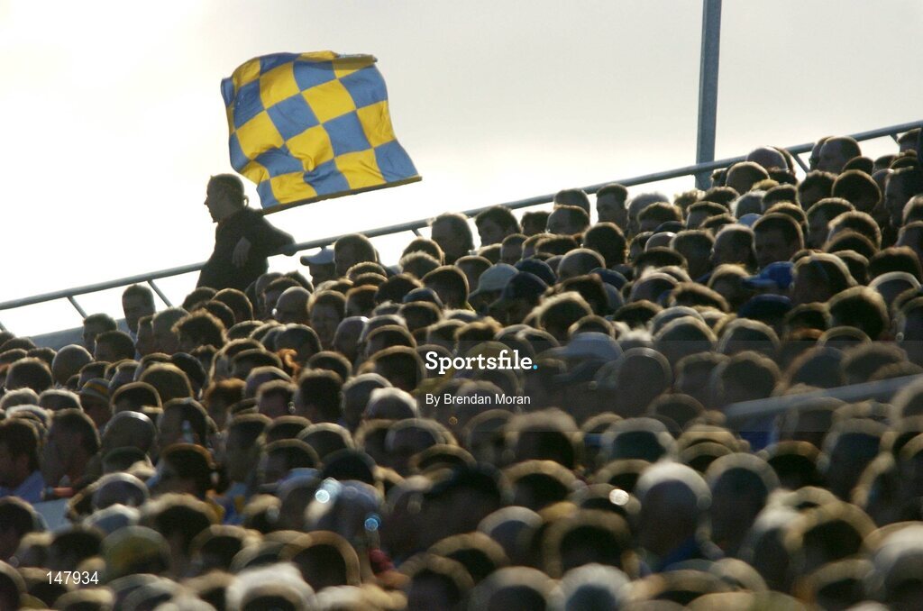 17 July 2004; A Clare fan sits with his flag fluttering in the wind during the game. Guinness Senior Hurling Championship Qualifier, Round 3, Clare v Offaly, Gaelic Grounds, Limerick. Picture credit; Brendan Moran / SPORTSFILE